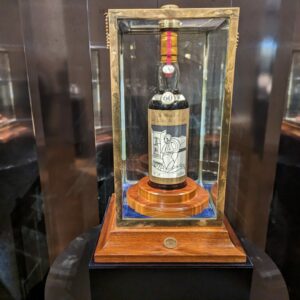 Macallan 1926, Valerio Adami, whisky auction, world record sale, luxury whisky, Scotch whisky, rare collectibles, whisky investment, auction news, Macallan collection, whisky aficionado, high-end spirits, Macallan mastery, historic whisky, record-breaking sale, Adami edition, fine spirits, whisky market, premium Scotch