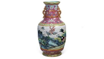A Qianlong Imperial Carved Porcelain Hollowed and Turned Vase with Phoenix Pattern and a Carmine Ground, Qing dynasty
